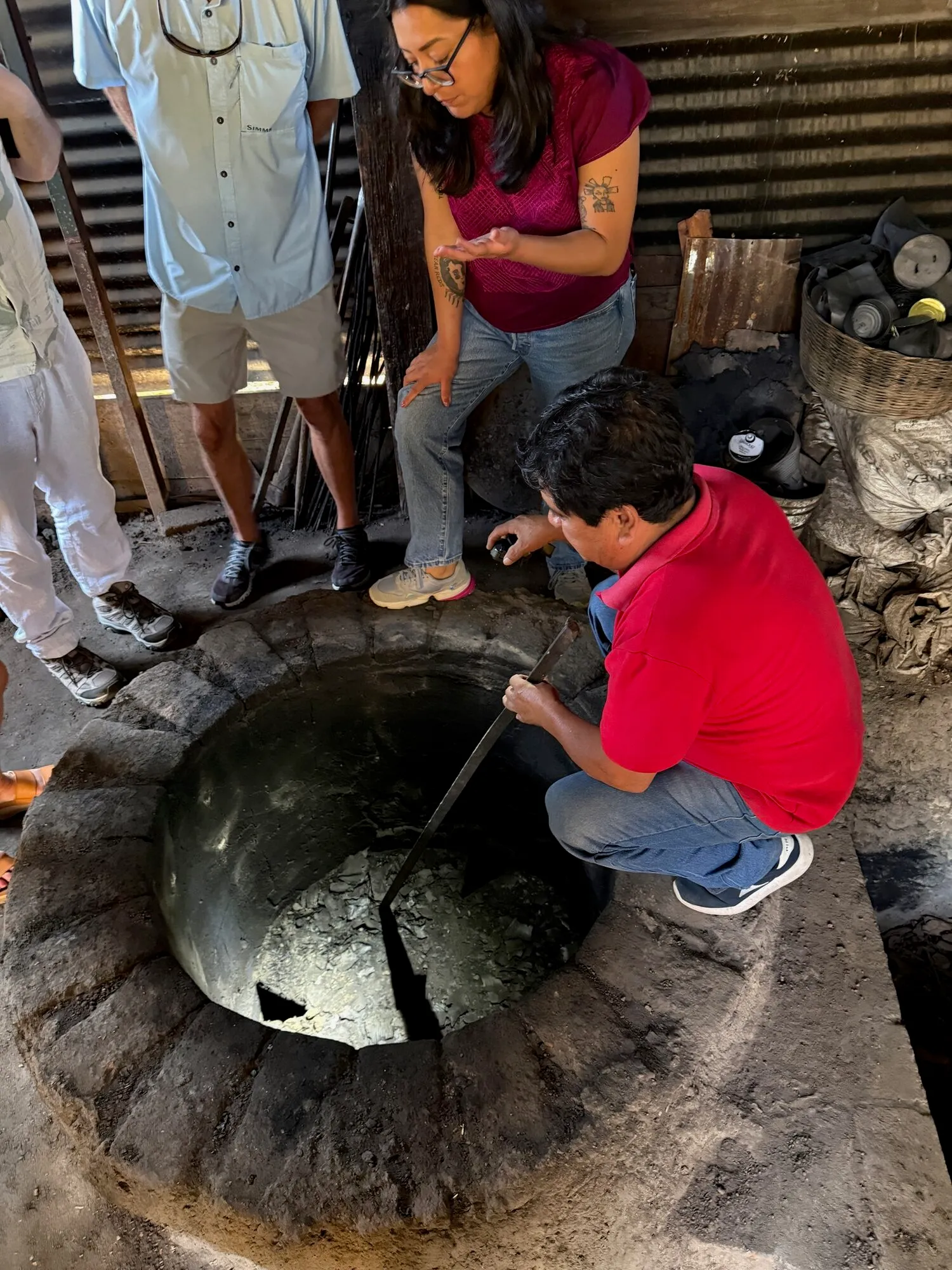 Tourists watching a traditional weaving demonstration